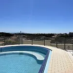 With Rooftop Pool *